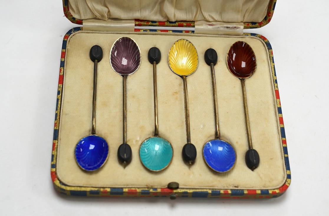 A cased set of six George V silver and polychrome enamelled coffee spoons, by Henry Clifford Davis, Birmingham, 1919. Condition - fair